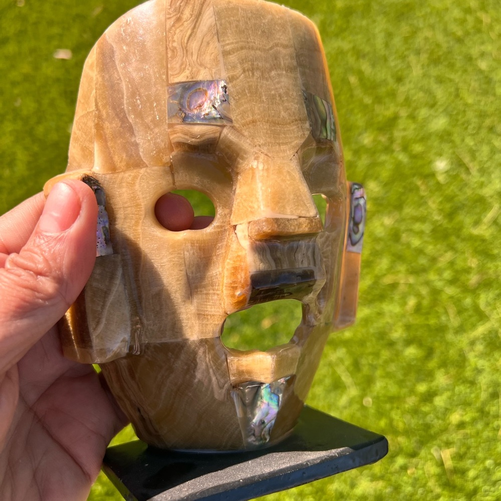 Mexican Onyx mask sculpture with abalone show